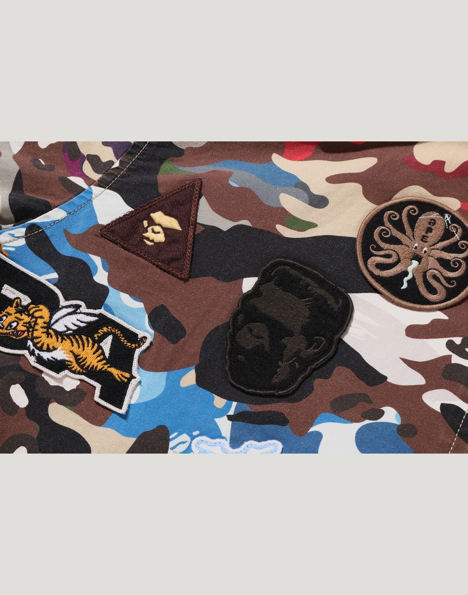 HYBRID CAMO MULTI BADGE JACKET MENS